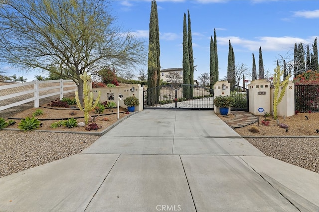 view of gate featuring fence