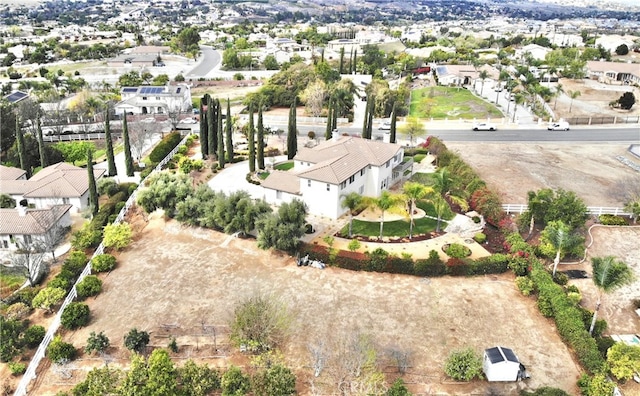 birds eye view of property with a residential view