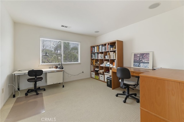 office area featuring visible vents, baseboards, and carpet floors