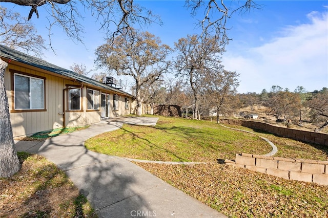 view of yard with fence and a patio