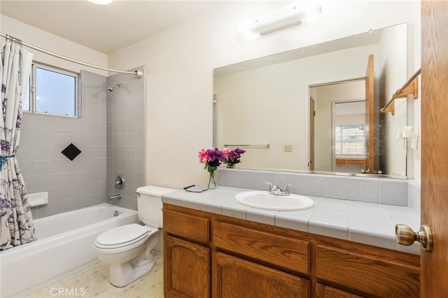 bathroom featuring shower / bath combo, vanity, and toilet