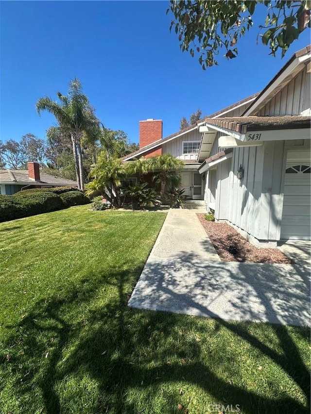 view of yard featuring an attached garage