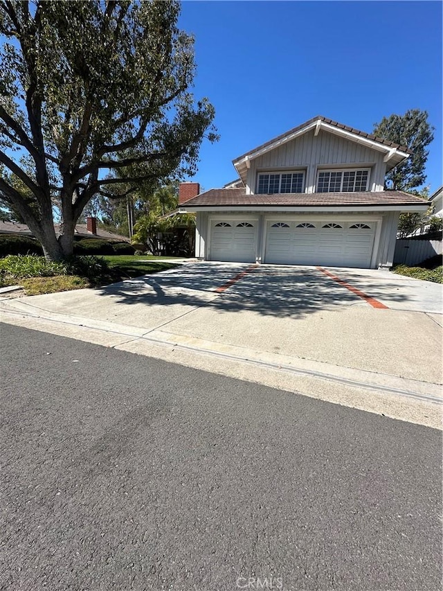 view of front of house featuring concrete driveway