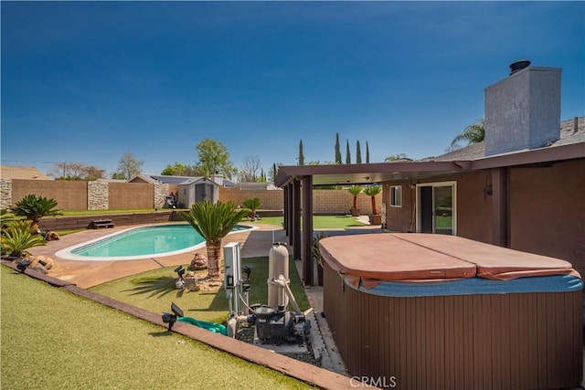 18218 Otilla St, Bloomington, CA 92316 - view of pool featuring an outbuilding, a storage shed, a fenced backyard, and a hot tub