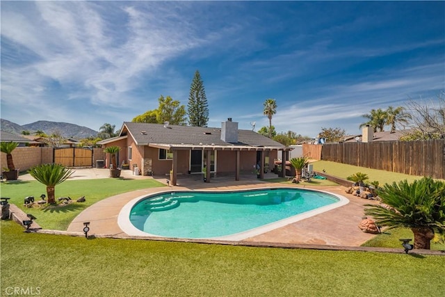 18218 Otilla St, Bloomington, CA 92316 - view of swimming pool featuring a fenced in pool, a lawn, a fenced backyard, and a patio area