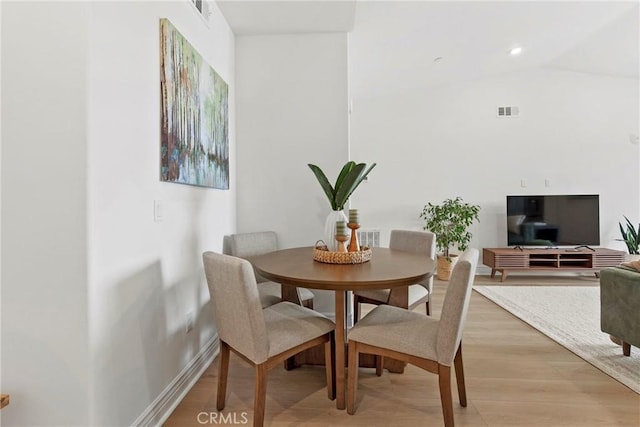 dining room with recessed lighting, light wood-style floors, visible vents, and baseboards