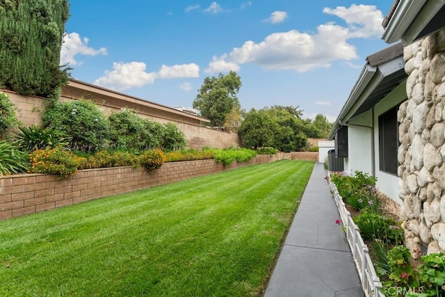 view of yard with a fenced backyard