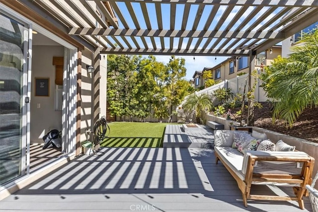 wooden deck with a fenced backyard, an outdoor hangout area, and a pergola