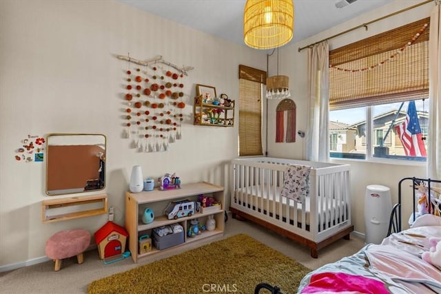 bedroom featuring carpet flooring and baseboards