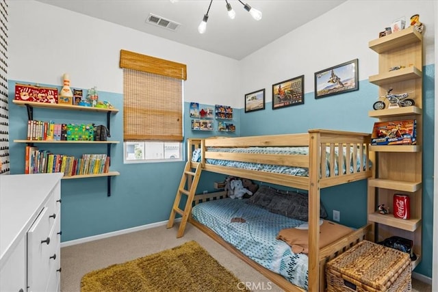 carpeted bedroom featuring visible vents and baseboards