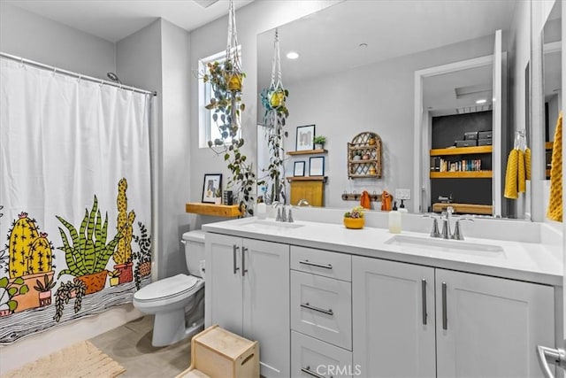 full bath featuring toilet, a shower with curtain, double vanity, and a sink