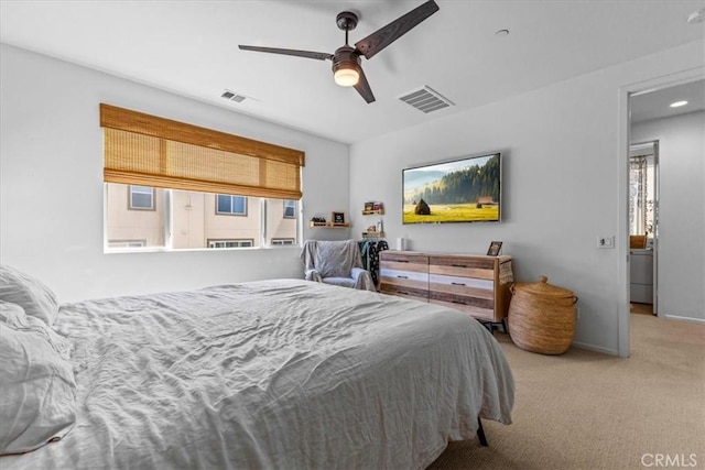 bedroom with multiple windows, visible vents, and carpet flooring