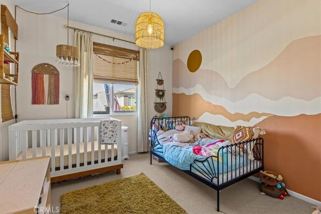 bedroom with carpet floors, visible vents, and baseboards