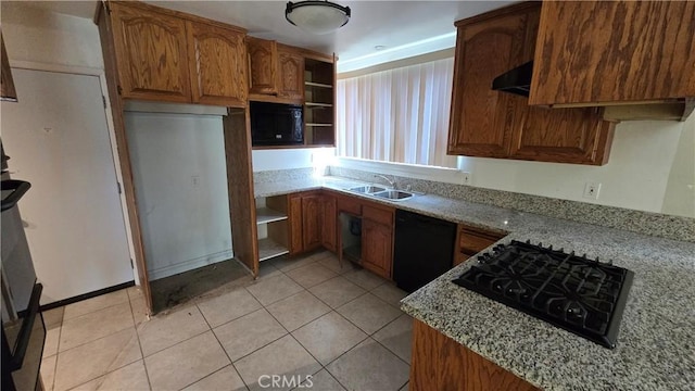 kitchen featuring light tile patterned flooring, a sink, black appliances, and open shelves