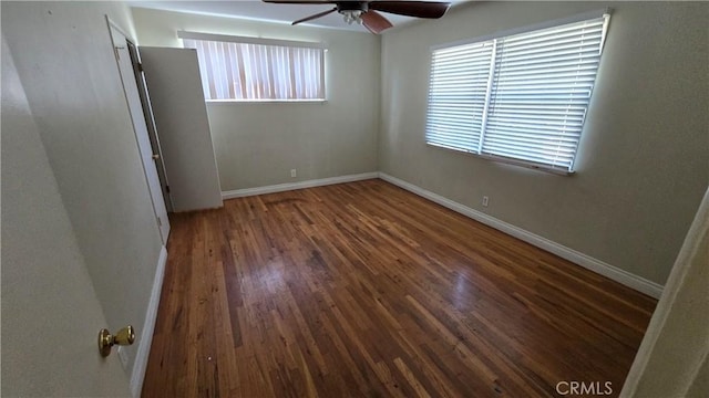 unfurnished bedroom with a ceiling fan, baseboards, and wood finished floors