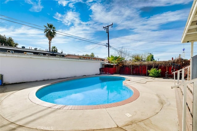 view of swimming pool featuring a patio area, a fenced backyard, and a fenced in pool