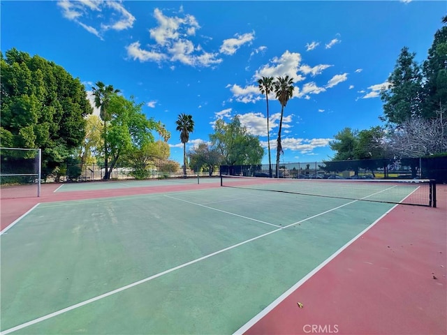 view of sport court with fence