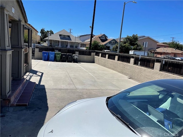 exterior space with a residential view and fence