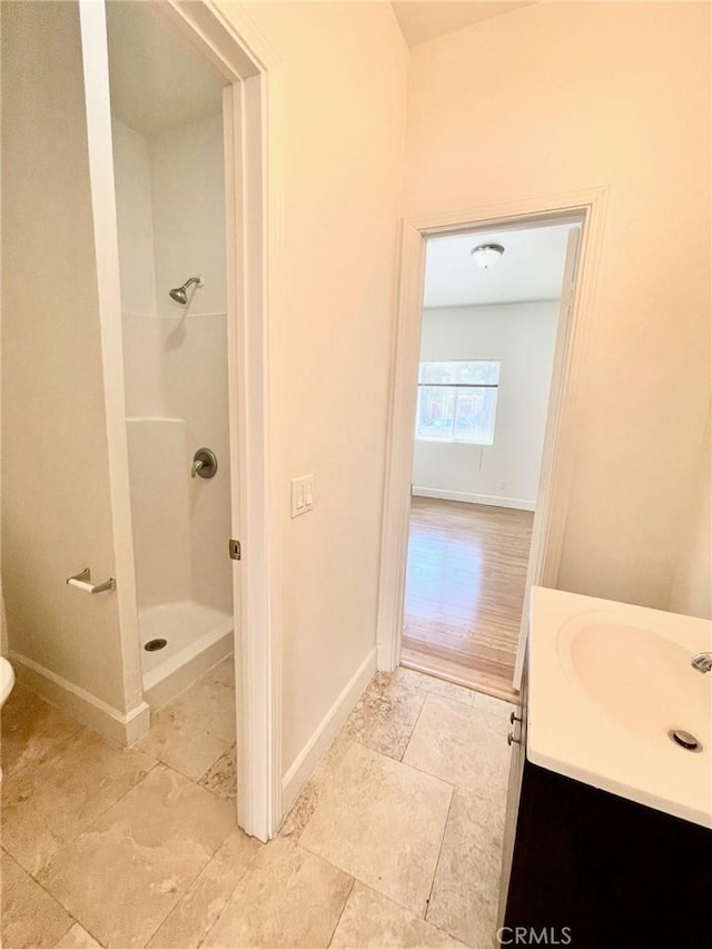 1238 W 35th St, Los Angeles, CA 90007 - full bath featuring a stall shower, baseboards, vanity, and tile patterned floors