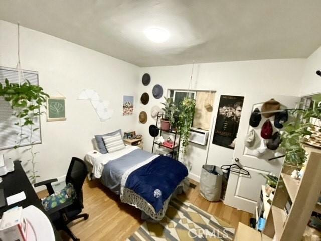 bedroom with wood finished floors