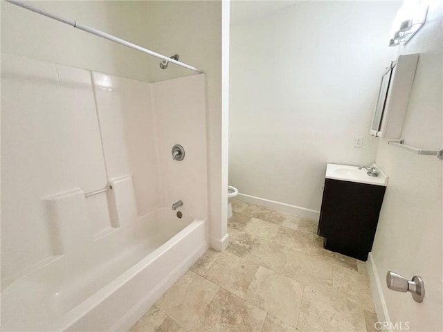 full bath with vanity, toilet, baseboards, and shower / washtub combination