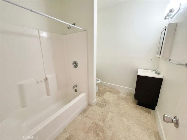 1238 W 35th St, Los Angeles, CA 90007 - bathroom featuring stone finish flooring, baseboards, vanity, shower / washtub combination, and toilet