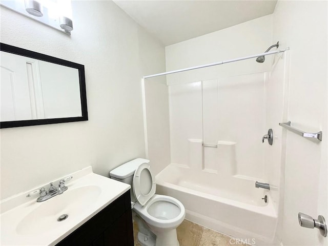 bathroom featuring toilet, vanity, and shower / bathtub combination