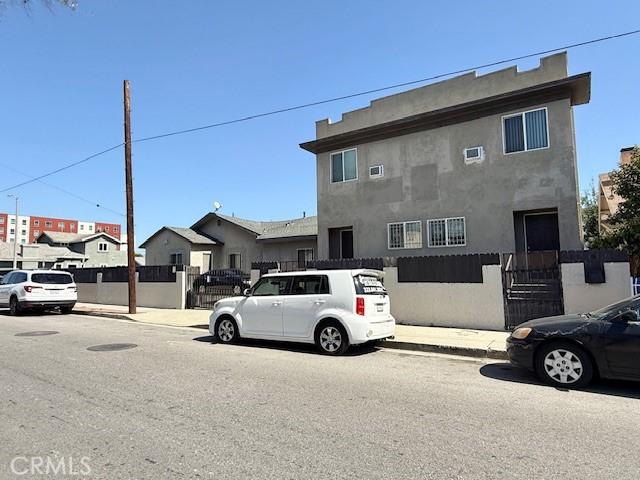 view of front of home featuring a fenced front yard and stucco siding