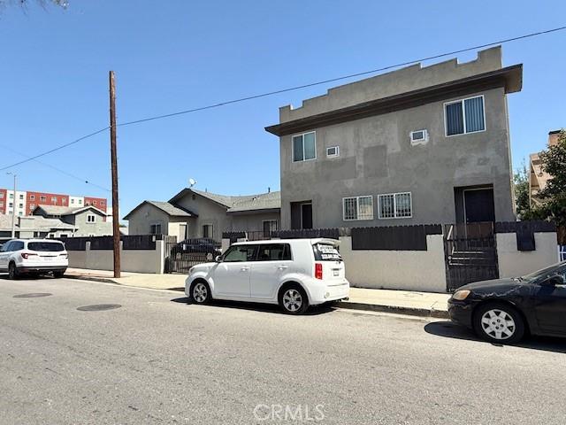 1238 W 35th St, Los Angeles, CA 90007 - view of asphalt street featuring sidewalks and curbs