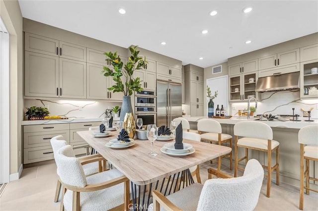 dining area featuring light tile patterned flooring, visible vents, and recessed lighting