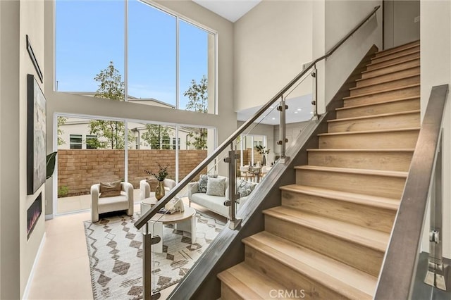 1155 Poppy Ct, Montebello, CA 90640 - stairs featuring a high ceiling, healthy amount of natural light, and tile patterned flooring