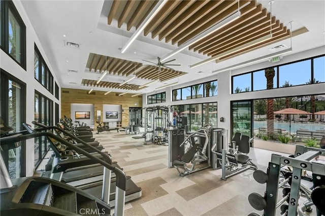 1155 Poppy Ct, Montebello, CA 90640 - workout area featuring ceiling fan, a towering ceiling, and carpet