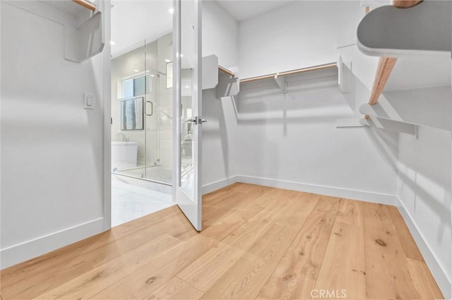 1155 Poppy Ct, Montebello, CA 90640 - walk in closet with wood finished floors