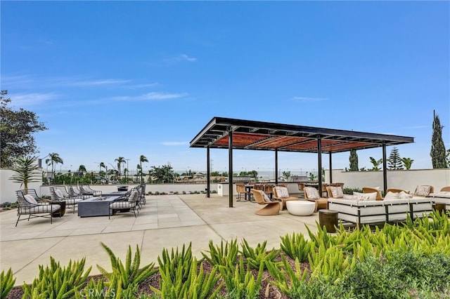 surrounding community featuring an outdoor hangout area and a patio area