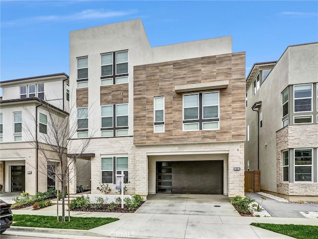 1155 Poppy Ct, Montebello, CA 90640 - view of front of home featuring a garage, driveway, and stone siding