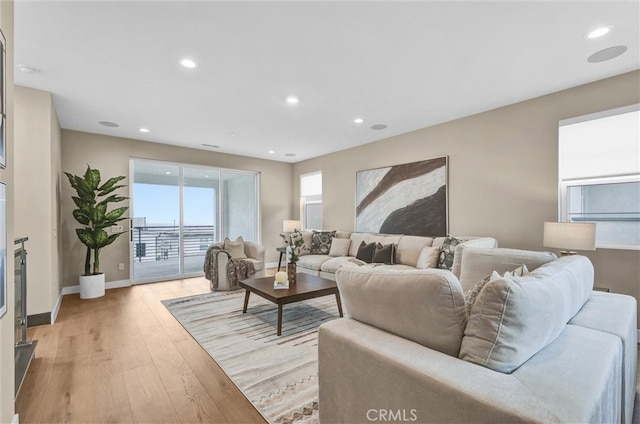 1155 Poppy Ct, Montebello, CA 90640 - living area featuring light wood finished floors, recessed lighting, and baseboards