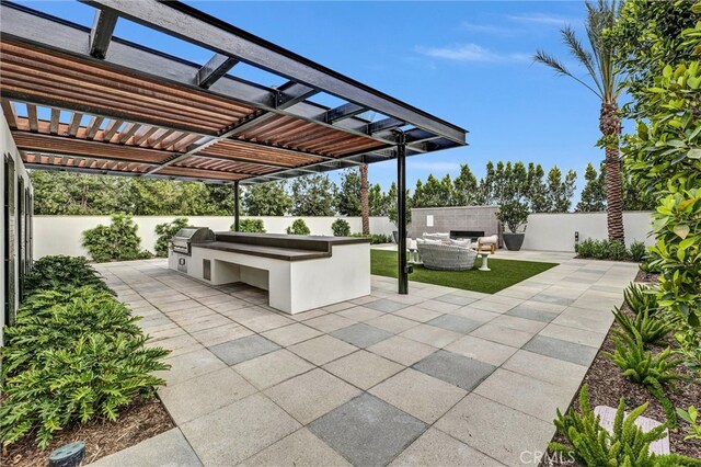 1155 Poppy Ct, Montebello, CA 90640 - view of patio featuring exterior kitchen, a fenced backyard, and area for grilling