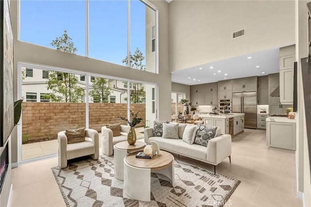1155 Poppy Ct, Montebello, CA 90640 - living area featuring a towering ceiling and light tile patterned floors
