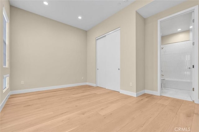 unfurnished bedroom featuring recessed lighting, baseboards, and light wood finished floors