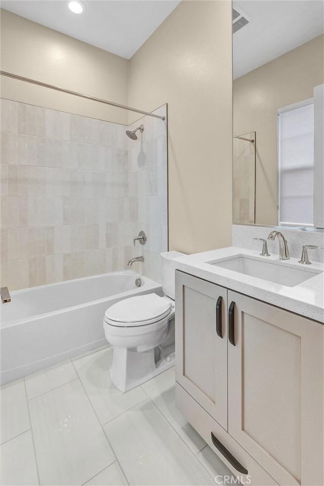 bathroom featuring visible vents, bathing tub / shower combination, toilet, and vanity