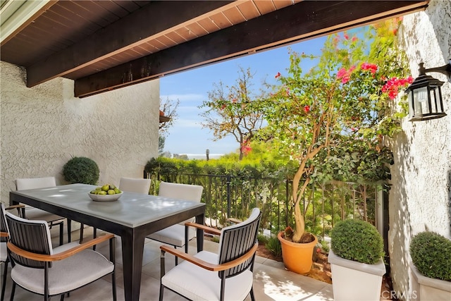 view of patio / terrace featuring outdoor dining space and fence