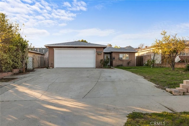 ranch-style house with a front yard, fence, stucco siding, concrete driveway, and a garage