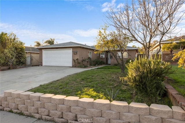 single story home featuring stucco siding, driveway, a garage, and a front lawn