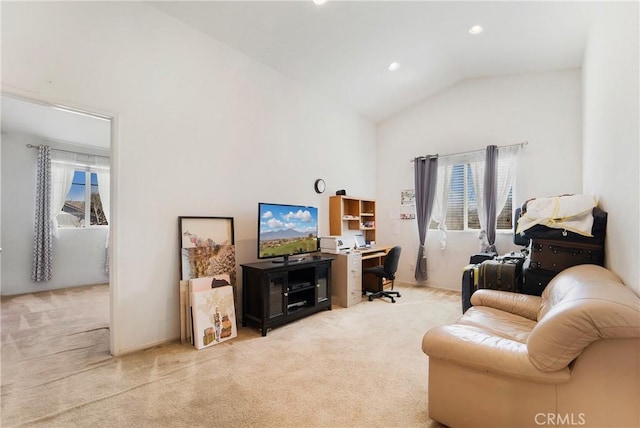 carpeted living room with lofted ceiling, plenty of natural light, and recessed lighting