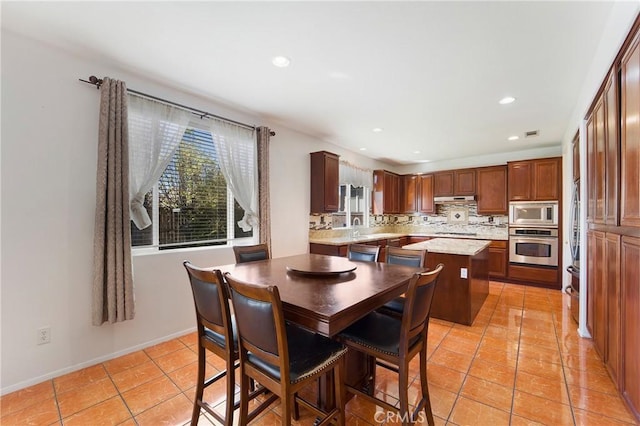 dining space featuring recessed lighting, visible vents, baseboards, and light tile patterned flooring