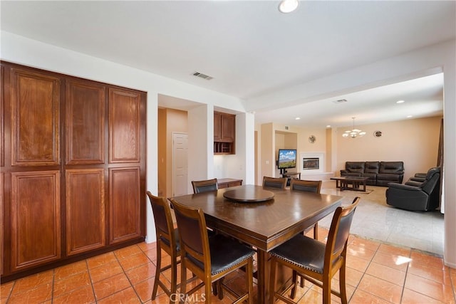 dining room with a chandelier, recessed lighting, visible vents, and light tile patterned floors