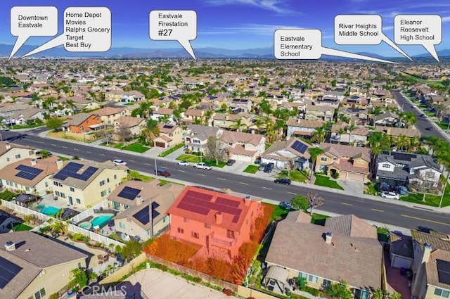 drone / aerial view featuring a mountain view and a residential view