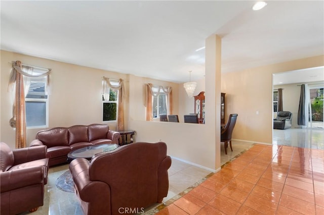 living area featuring recessed lighting, light tile patterned flooring, and baseboards