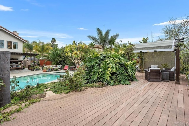 wooden deck featuring an outdoor pool, a patio area, an outdoor living space, and a pergola