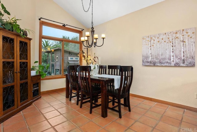 tiled dining room with vaulted ceiling, baseboards, and an inviting chandelier